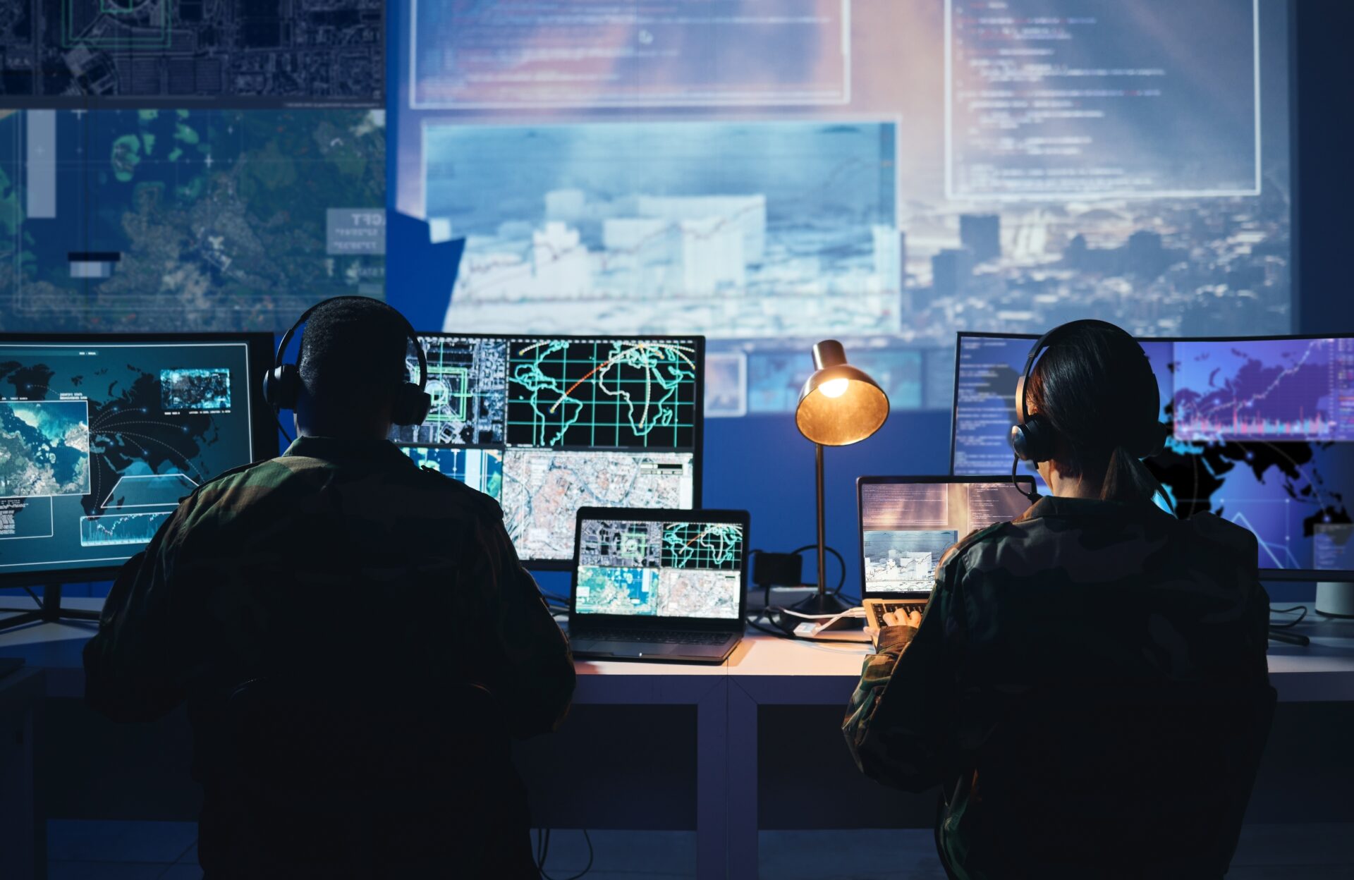 Military,Control,Room,,Computer,Screen,And,Team,With,Surveillance,,Headset